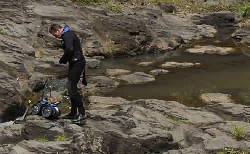 Tragic: A police diver prepares to enter the water at Hanging Rock Falls near Wadeville, north of Kyogle, in search of a missing 14-year-old boy. The teenager’s body was recovered about 11am yesterday. Tragic: A police diver prepares to enter the water at Hanging Rock Falls near Wadeville, north of Kyogle, in search of a missing 14-year-old boy. The teenager’s body was recovered about 11am yesterday.